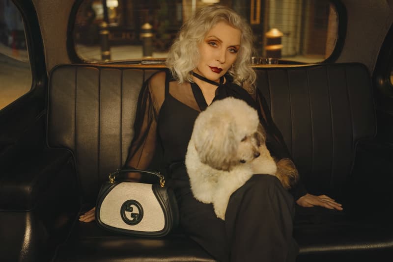 gucci blondie kelsey lu woman body red background suede brown bag