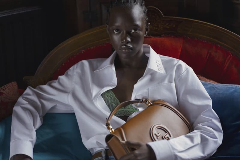 gucci blondie kelsey lu woman body red background suede brown bag