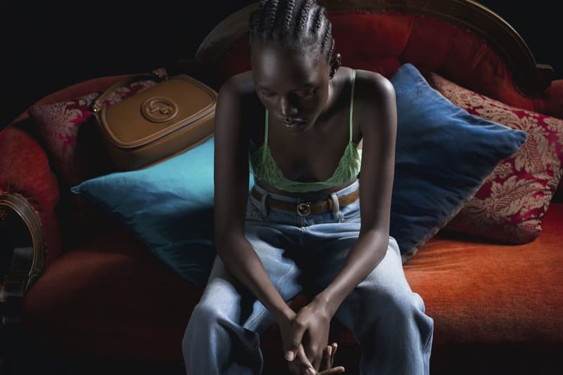 gucci blondie kelsey lu woman body red background suede brown bag