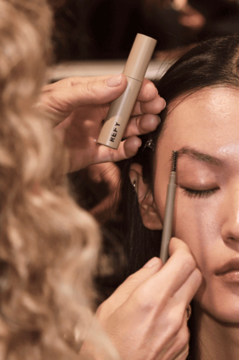 woman in white dress backstage, refy makeup, christoper esber, beauty, paris fashion week, spring/summer 2025