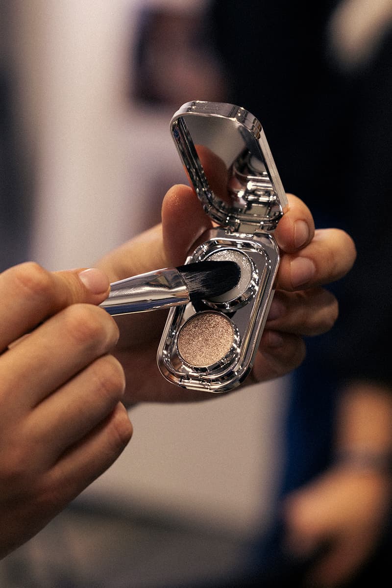 model getting lip gloss painted on, rabanne beauty, paris fashion week, spring/summer 2025