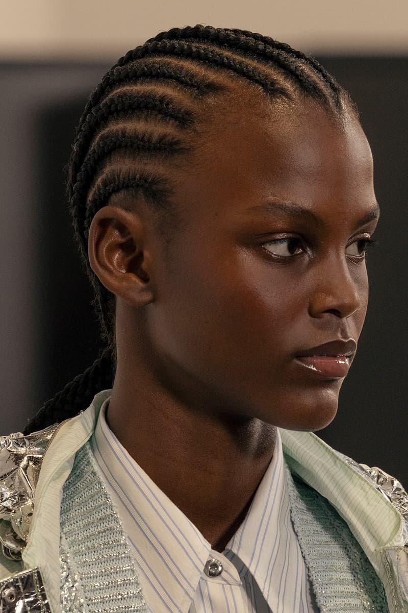 model getting lip gloss painted on, rabanne beauty, paris fashion week, spring/summer 2025