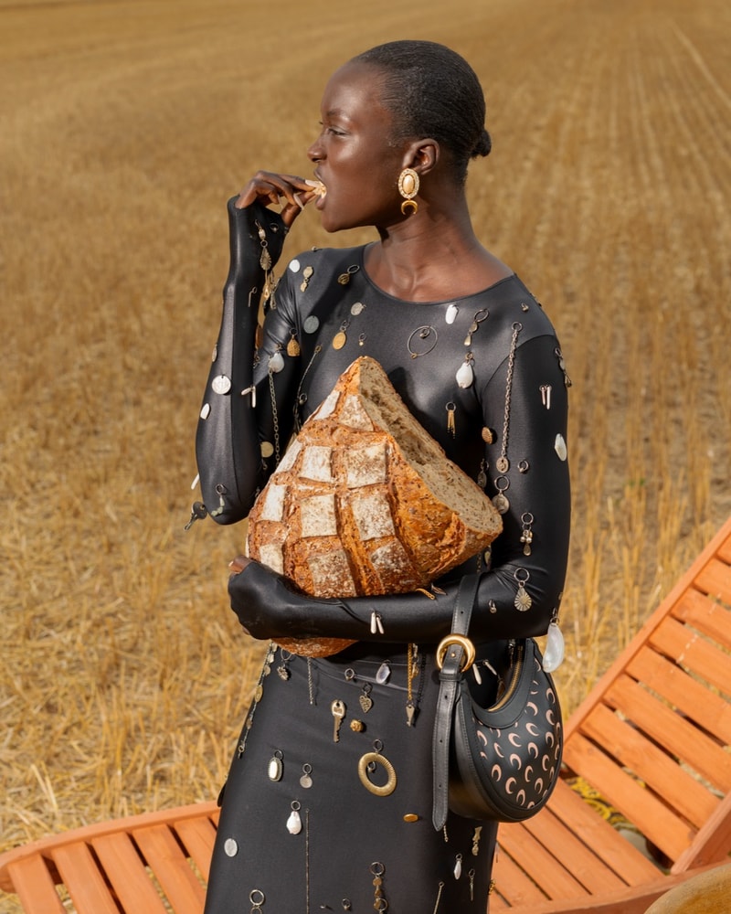marine serre bodies people gathering ground grass crescent moon bodysuits flesh
