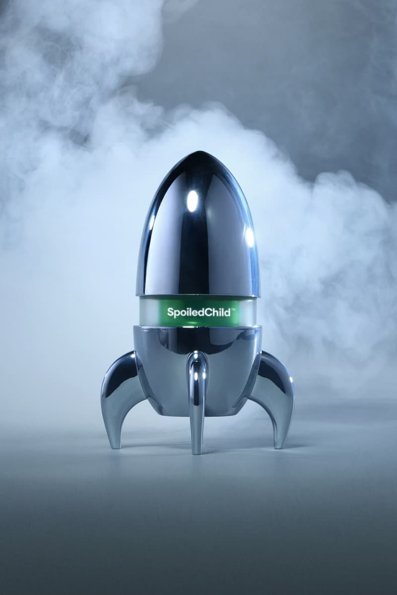 jeremy scott holding a silver rocketship filled with skincare, spoiledchild, moschino