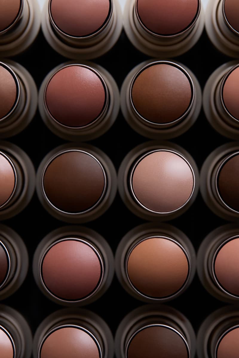 kim kardashian posing with red hair and new skkn by kim matte lipstick, makeup, skincare, kardashians