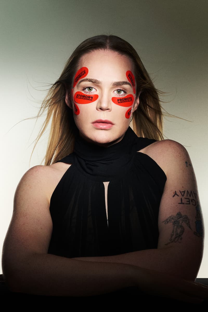 woman with curly hair and dieux "promote homosexuality" forever eye mask, skincare