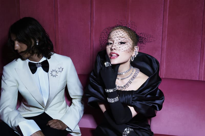 swarovski holiday jewelry diamonds ariana grande pink background black dress