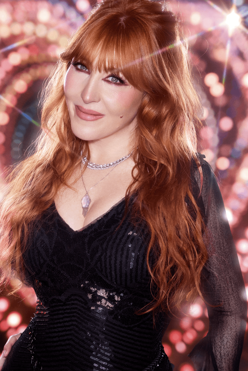 michaela jay posing with highlighter wand, charlotte tilbury holiday campaign, beauty, makeup 