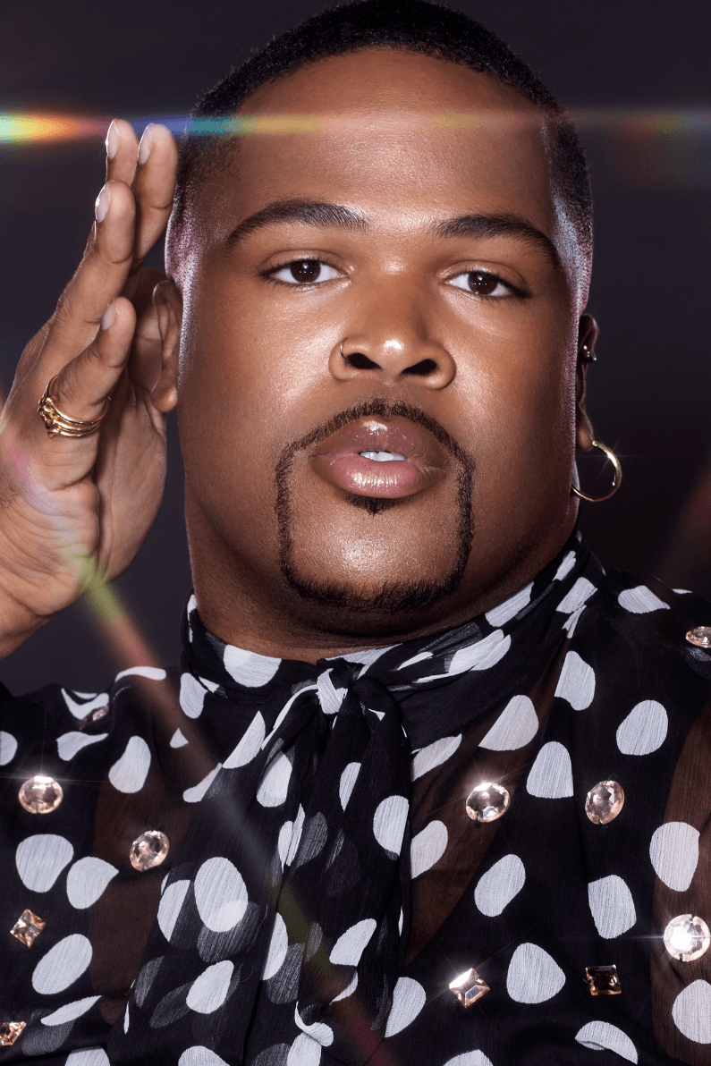 michaela jay posing with highlighter wand, charlotte tilbury holiday campaign, beauty, makeup 