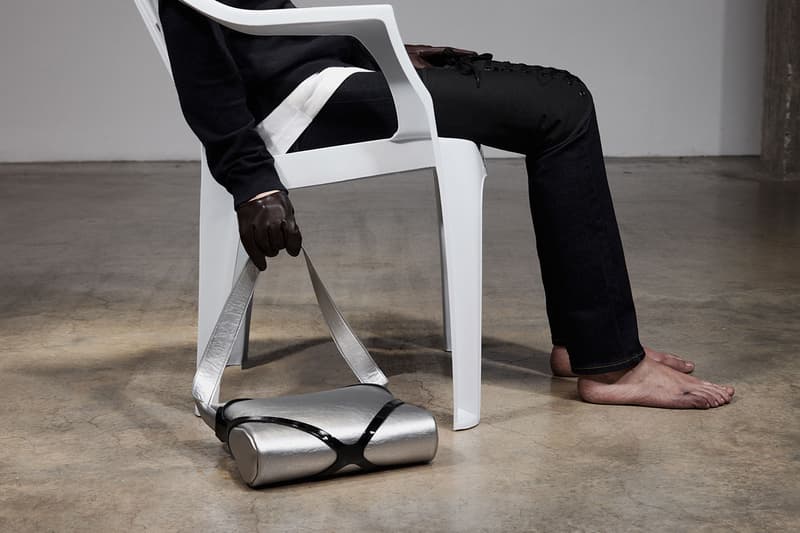 puppets and puppets brand bags woman floor legs leather black hair sunglasses