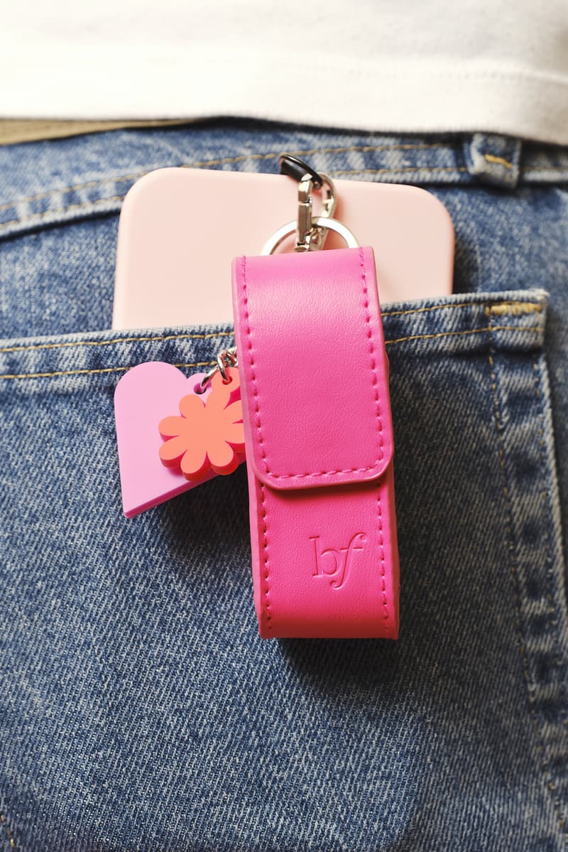 beauty keycharm hanging off of a denim pocket, makeup, skincare, haircare, trend 