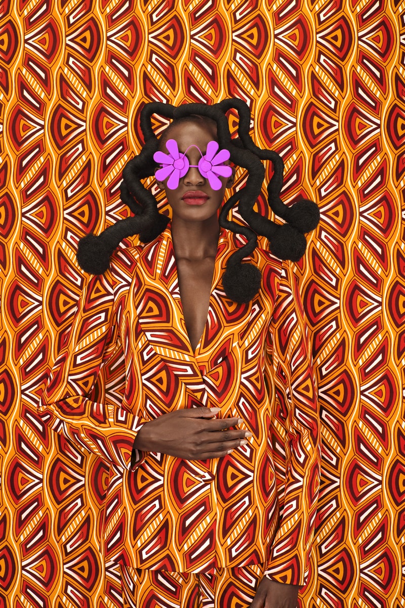 woman with sculptural braids and dreads posing with blue sunglasses, oribe haircare, holiday 2024, hair