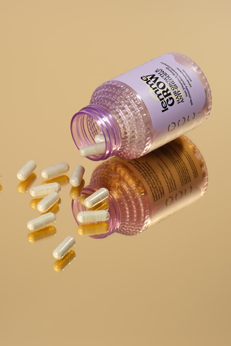 kourtney kardashian posing with supplement in her mouth, hair growth vitamin, wellness, lemme grow