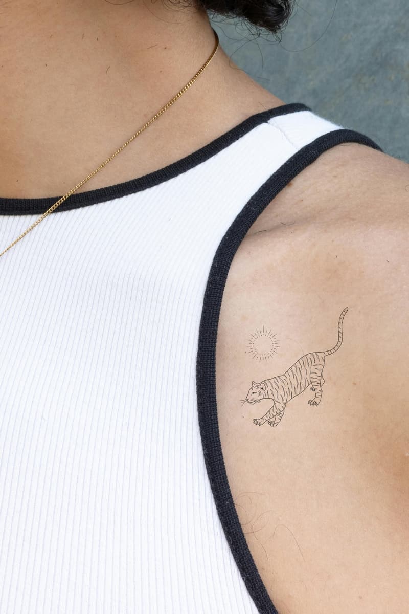 woman wearing wellness patch from barriére collaboration with bluestone babe, tattoo patch, vitamins, beauty 