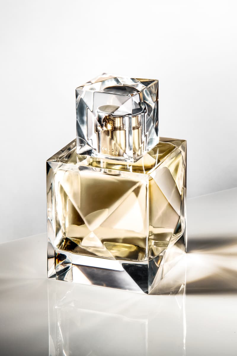 khloe kardashian poses with slicked back hair and makeup, xo khloé, fragrance, perfume, beauty