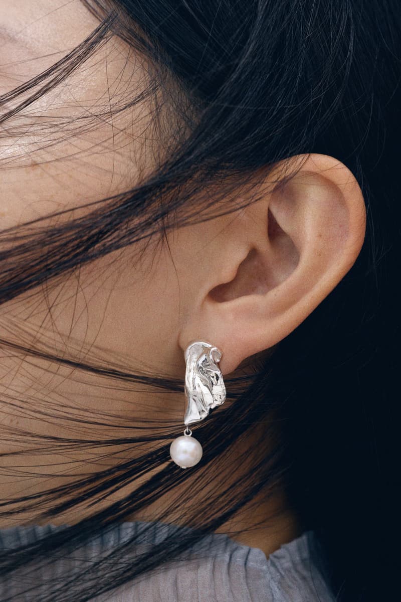 woman wearing merit and completedworks earrings close-up, accessories, fragrance, makeup, skincare