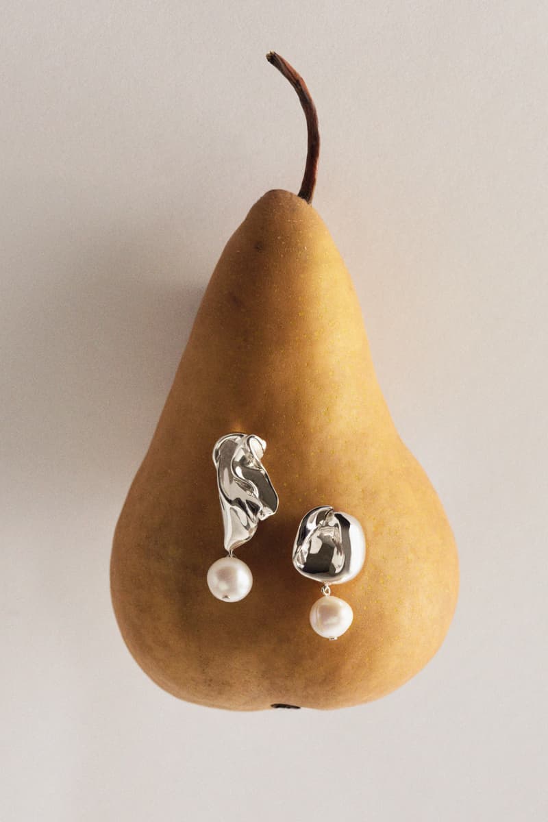 woman wearing merit and completedworks earrings close-up, accessories, fragrance, makeup, skincare