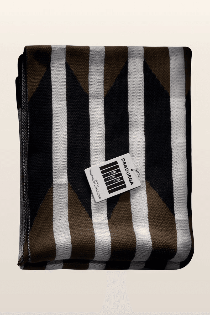 woman wrapped up in blanket, brown throw, homeware, fragrance, perfume, cotton incorporated, d.s. & durga