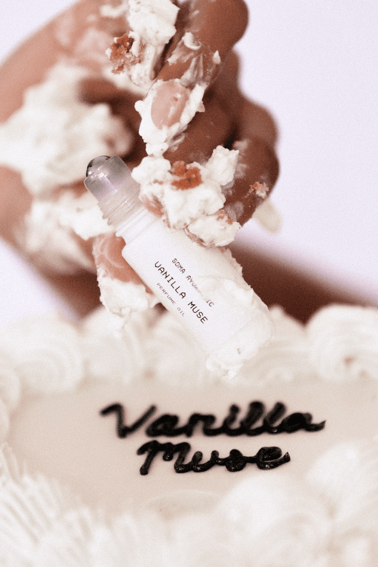 woman wearing black glove applying soma ayurvedic perfume oil in vanilla muse, fragrance, wellness, indian beauty