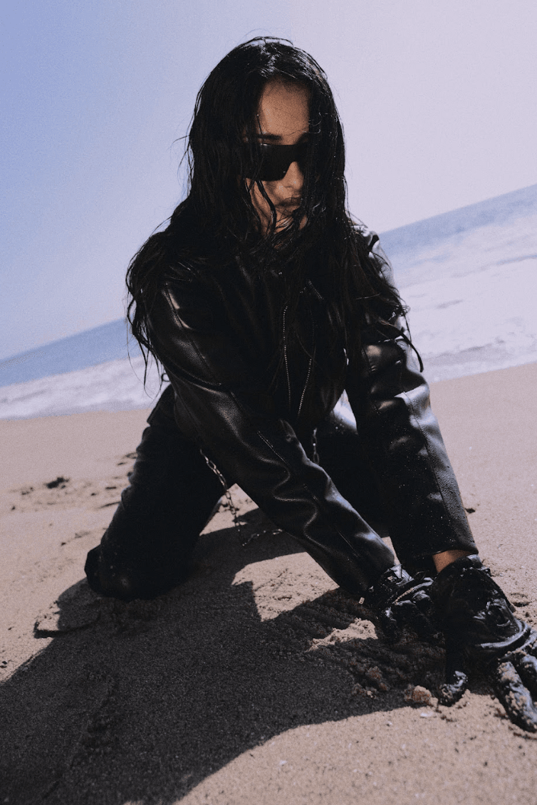 woman wearing black glove applying soma ayurvedic perfume oil in vanilla muse, fragrance, wellness, indian beauty