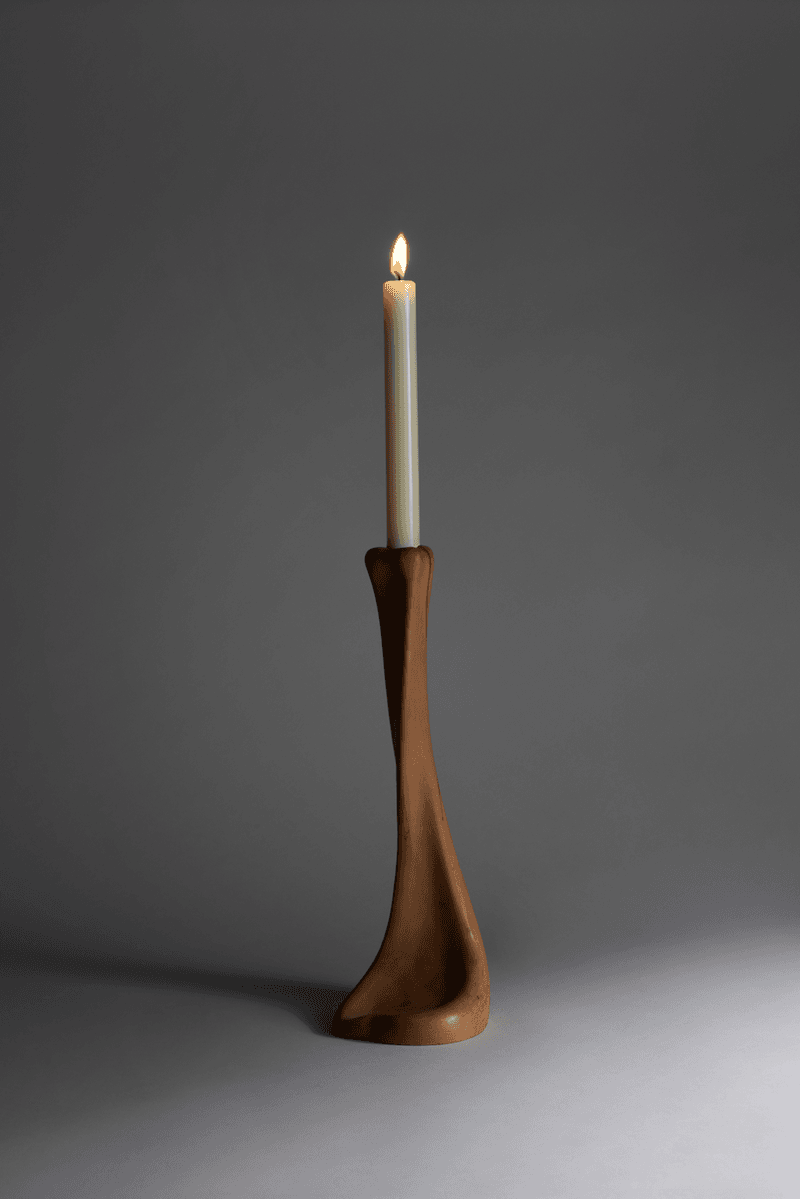 woman caressing bottle of saie beauty glowy super gel in warm glow, swatch of highlighting primer, makeup, skincare