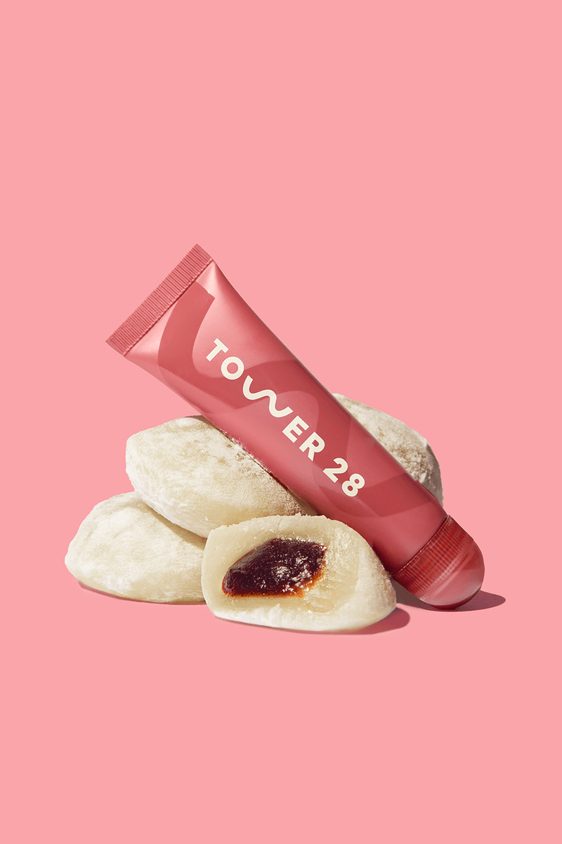 tower28 lip treatment, lipsoftie in red bean mochi, red bean cake near tea cup, woman wearing lip balm, skincare, makeup