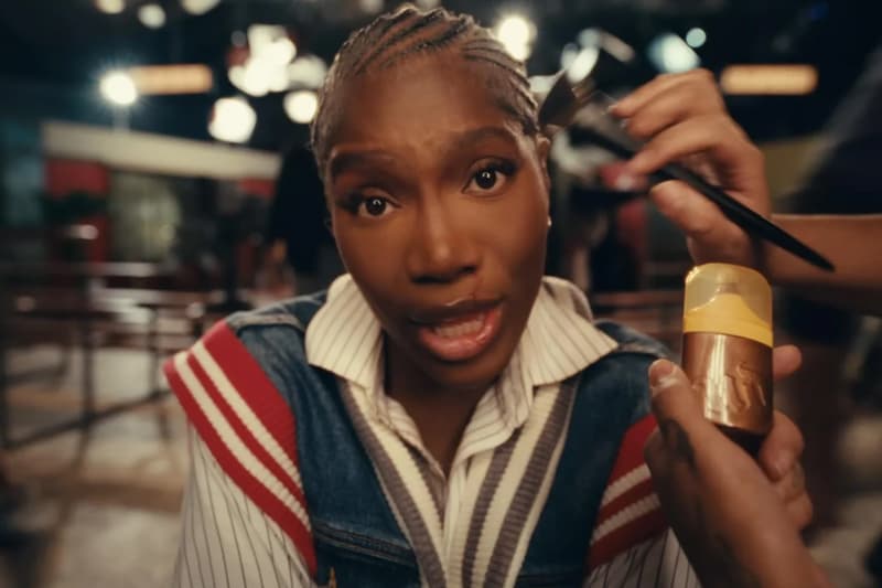 doechii posing while makeup artist applies new urban decay face bond luminizer, makeup, beauty, denial is a river music video, rap