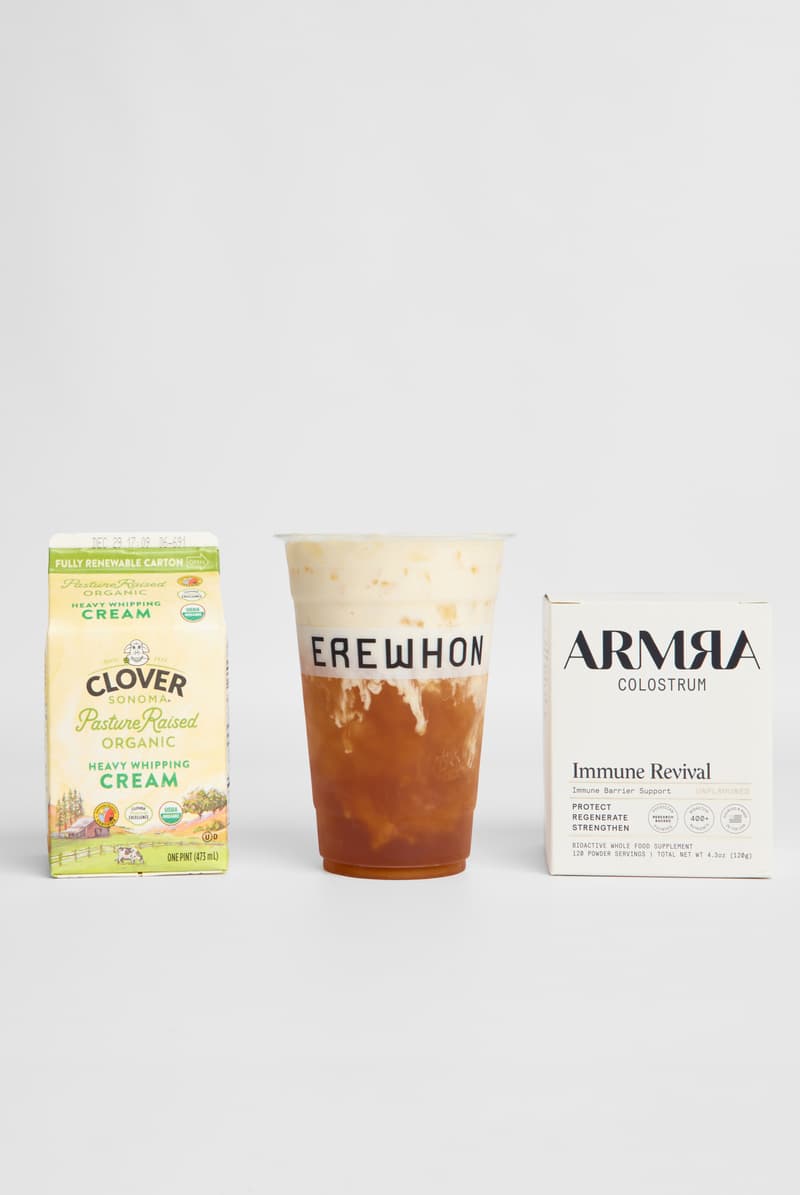 lisa blackpink posing with thai up the world drink, thai iced tea, erewhon smoothie, healthy beverage, wellness, k-pop