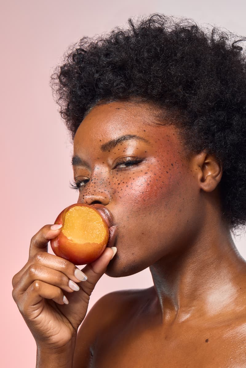 five people holding peaches, posing closely together, "me" fragrance, snif, perfume, beauty