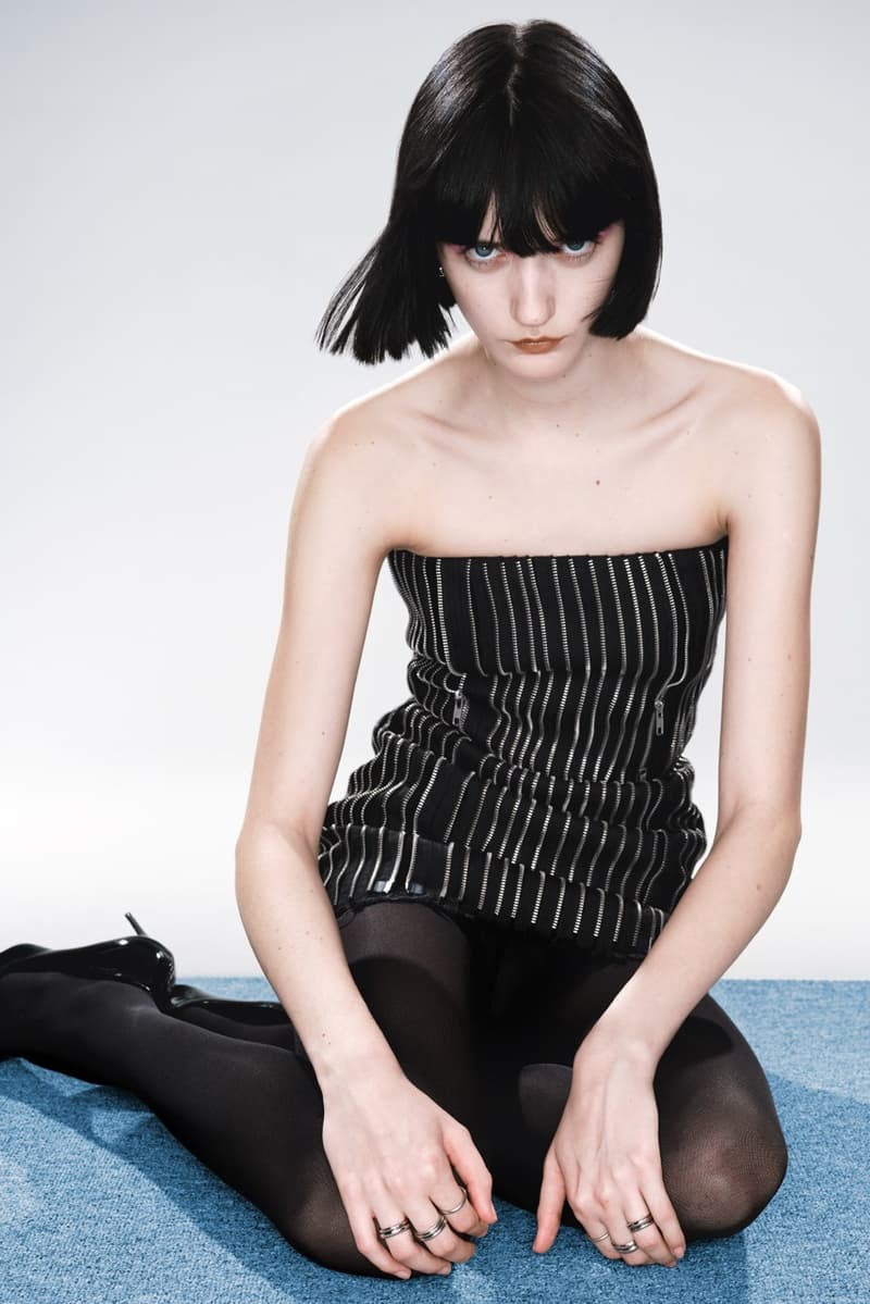 weekday limited edition collection woman girl lying down rug carpet black glossy