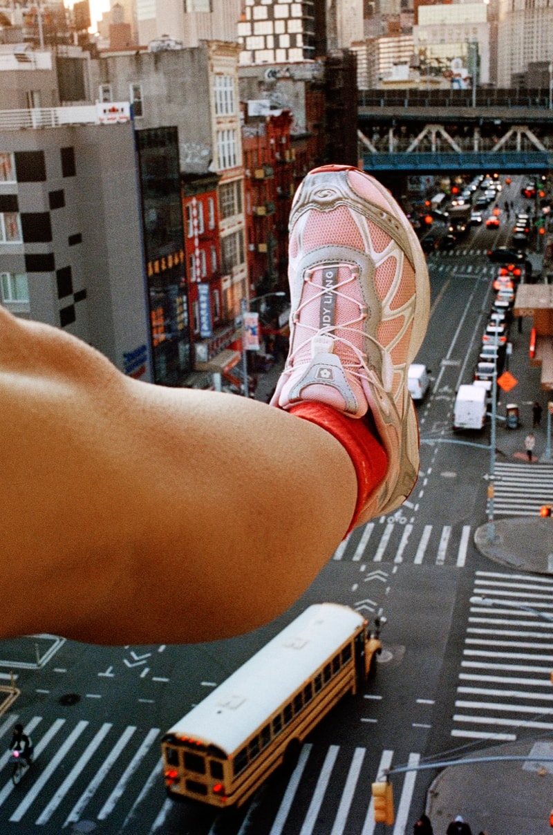 salomon sandy liang pink red silver sneakers trainers girl building balcony city