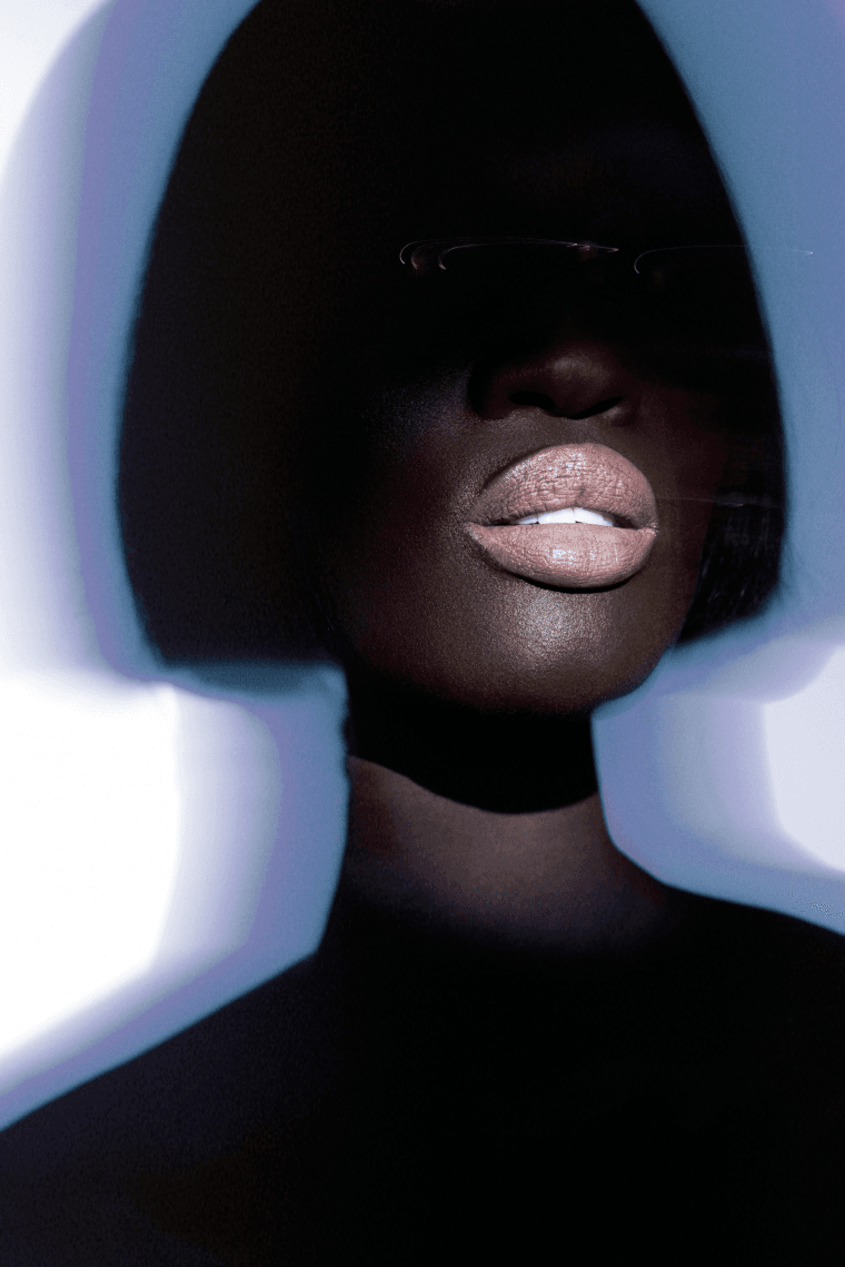 woman surrounded by flowers laying down, od beauty, makeup brand, ossiel ramos, diego díez