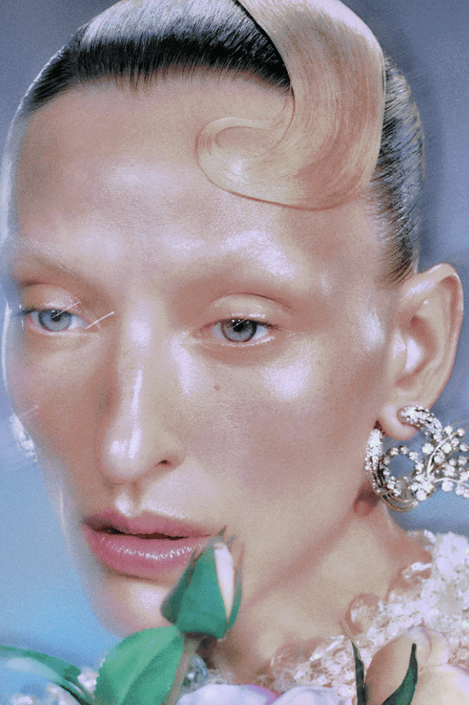 woman surrounded by flowers laying down, od beauty, makeup brand, ossiel ramos, diego díez