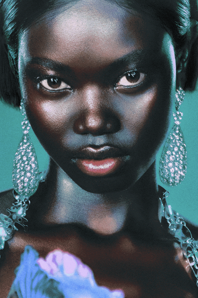 woman surrounded by flowers laying down, od beauty, makeup brand, ossiel ramos, diego díez