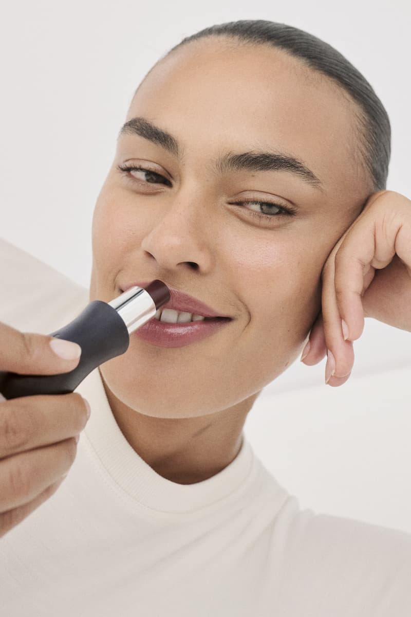 model holding tilt makeup product, accessible beauty, soriatic arthritis 