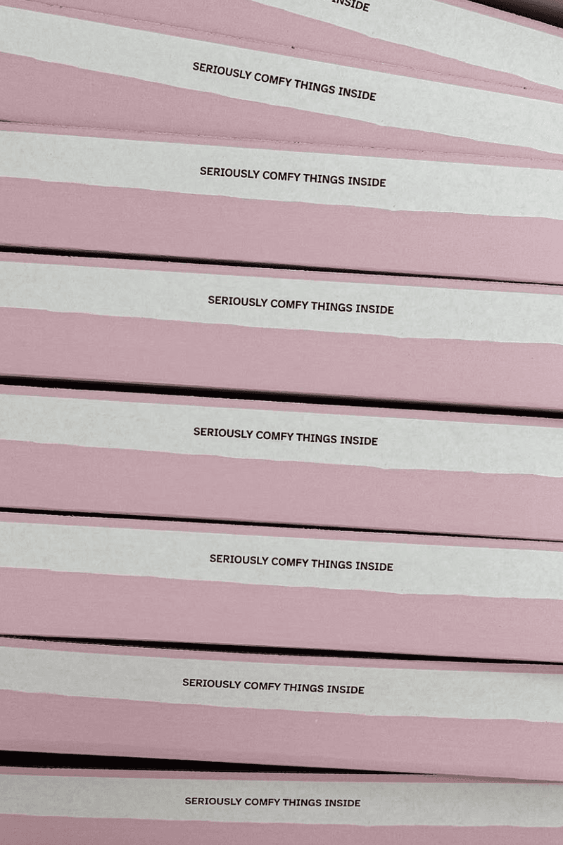 model holding tilt makeup product, accessible beauty, soriatic arthritis 