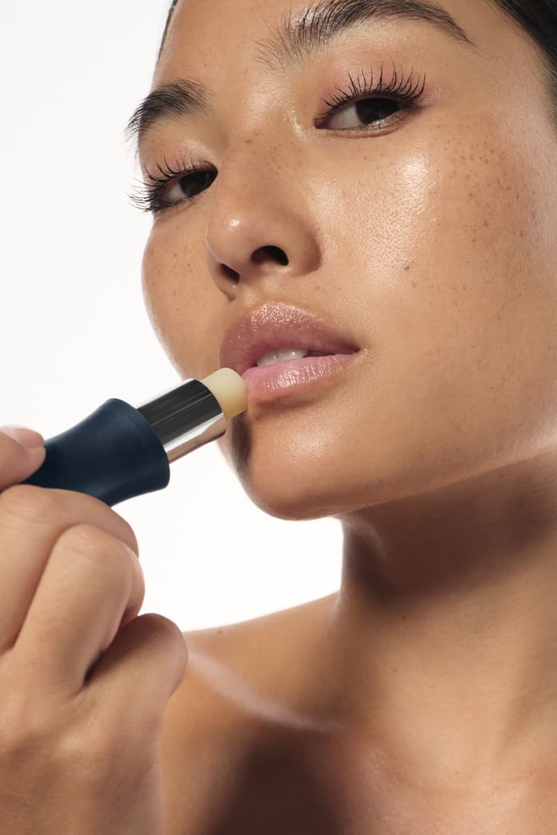 model holding tilt makeup product, accessible beauty, soriatic arthritis 