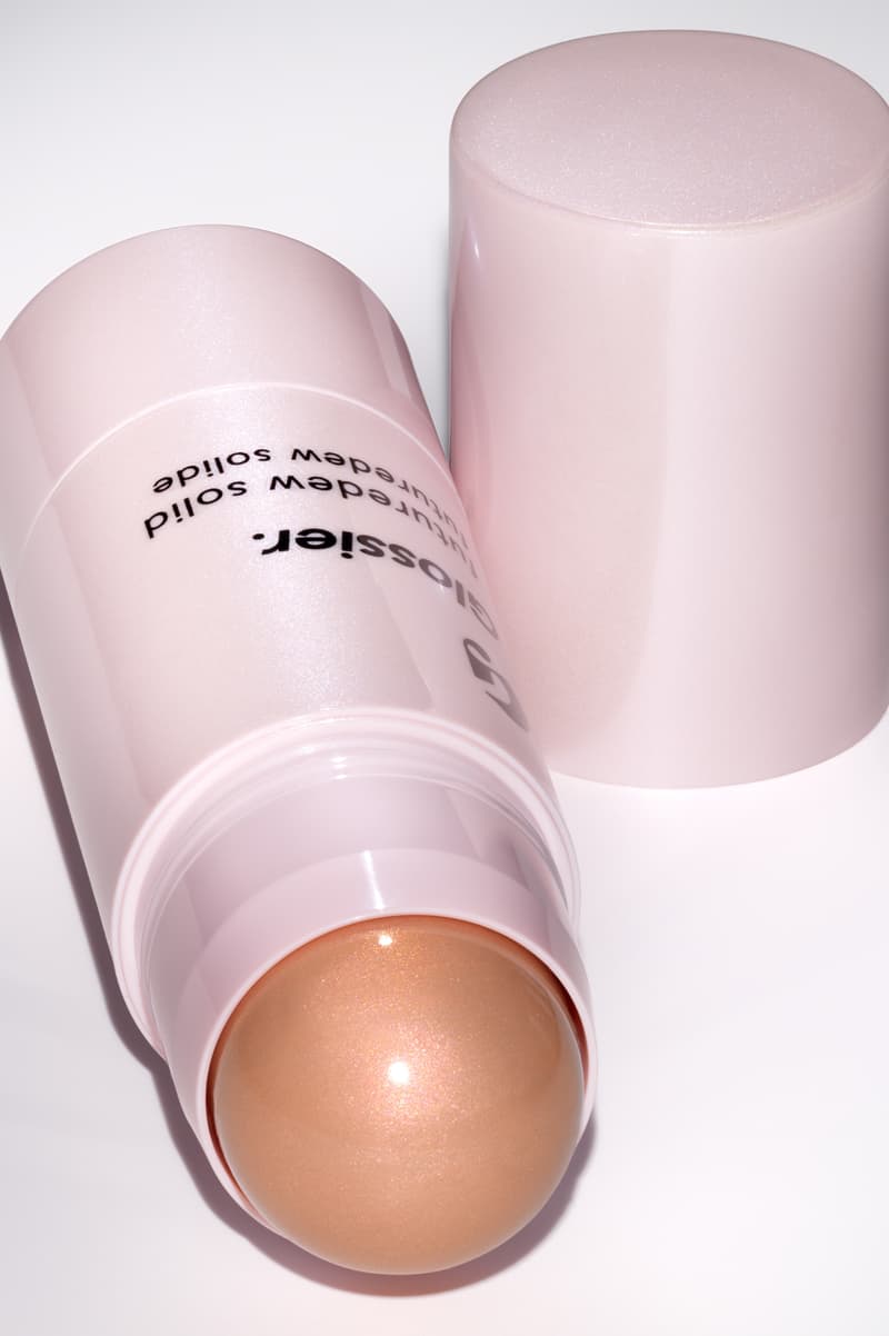 woman posing with new glossier futuredew solid serum, skincare-makeup hybrid, beauty