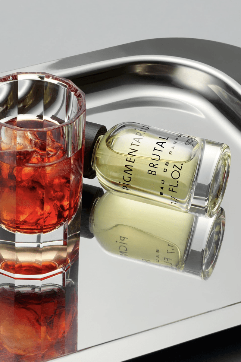 fragrance on chrome tray with negroni drink, pigmentarium "brutal" perfume, beauty 