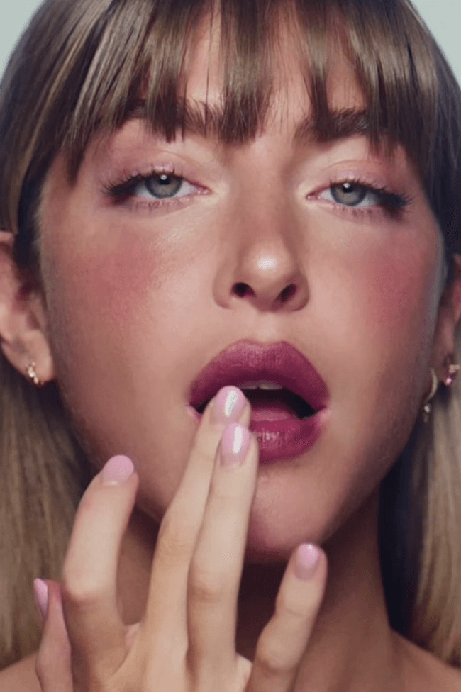 founder of simihaze beauty posing with new color glaze lip and cheek pigment, makeup, beauty