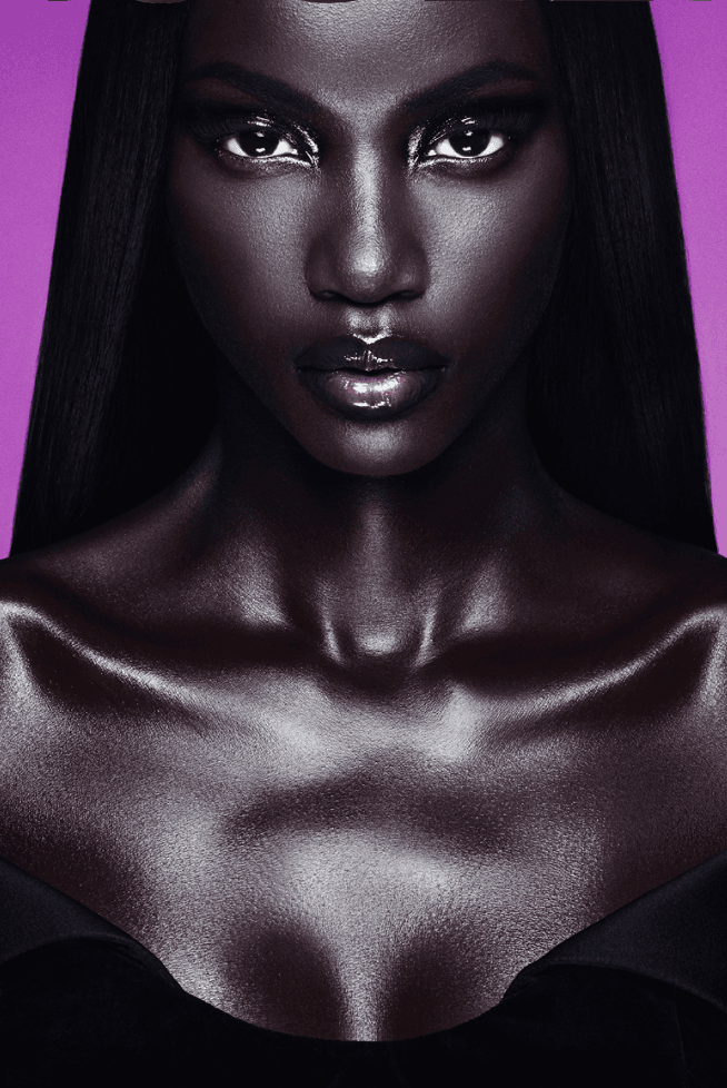 anok yai posing with a bottle of mugler alien extraintense, fragrance, perfume, beauty