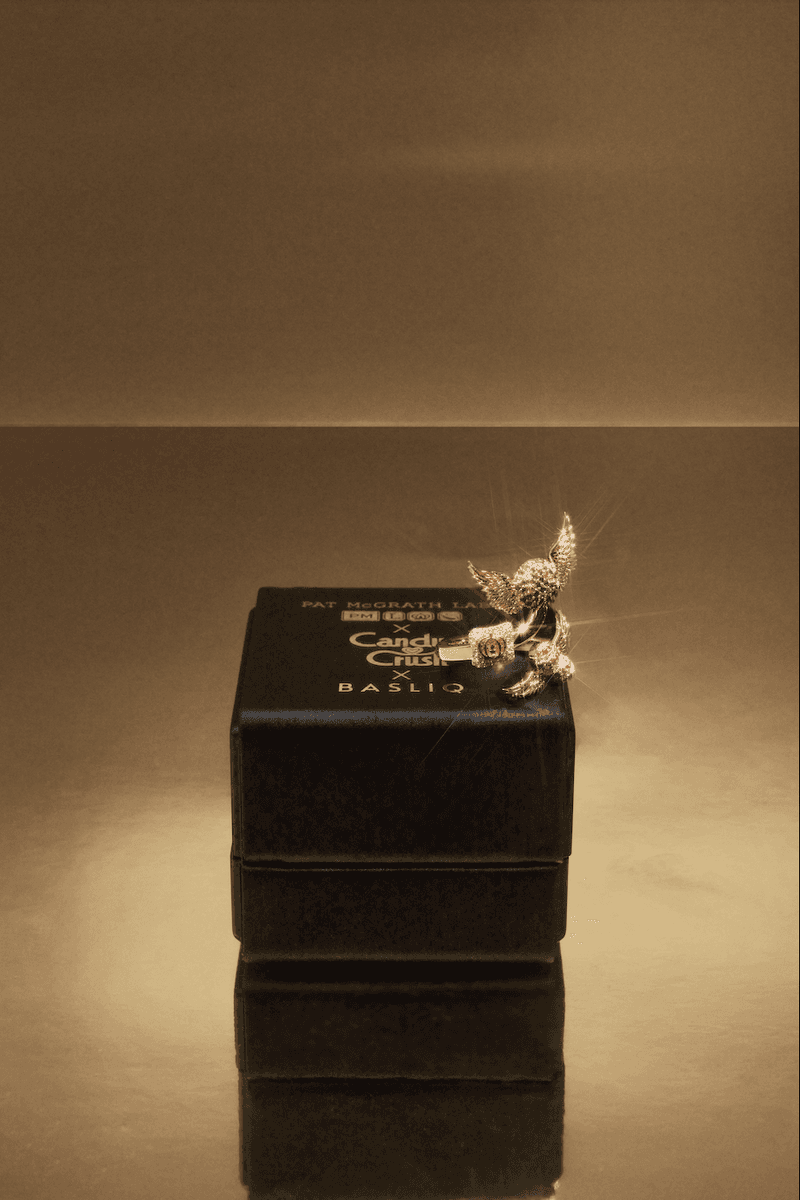 photo of a candy with candy cane design nails wearing nice diamond jewelry with a lipstick, diamond-encrusted ring, candy crush and pat mcgrath labs makeup collaboration, beauty