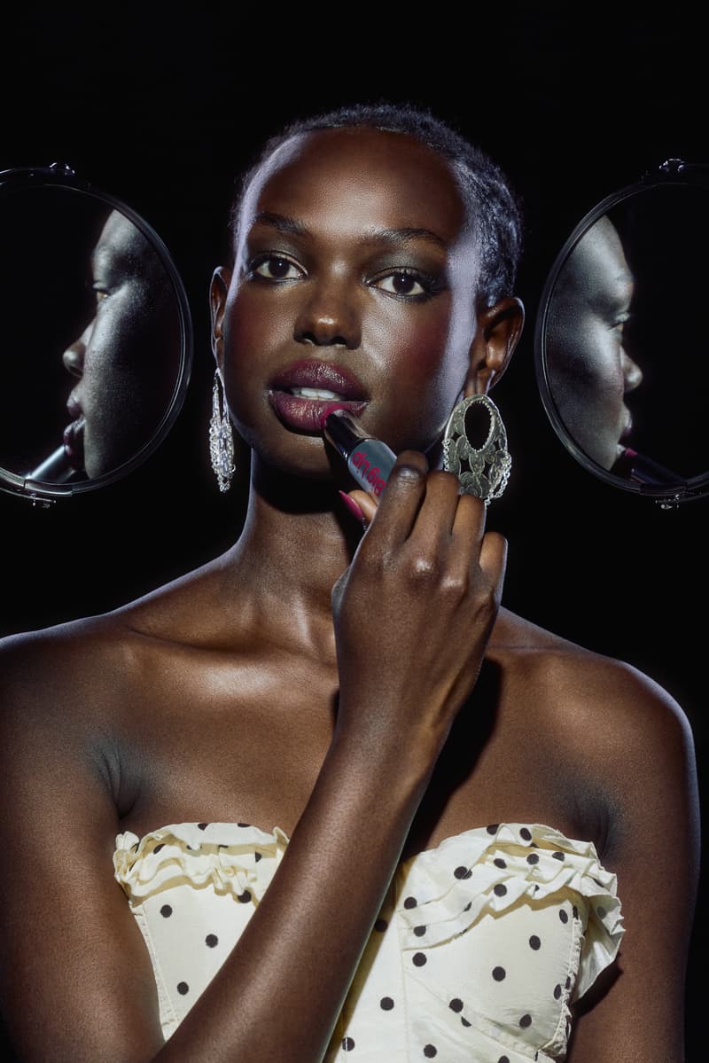 woman applying pleasing lip and cheek tint with mirrors, makeup, beauty, harry styles