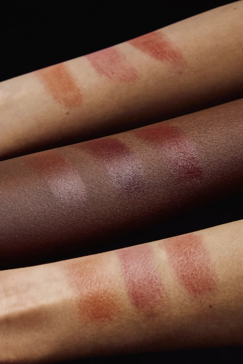 woman applying pleasing lip and cheek tint with mirrors, makeup, beauty, harry styles