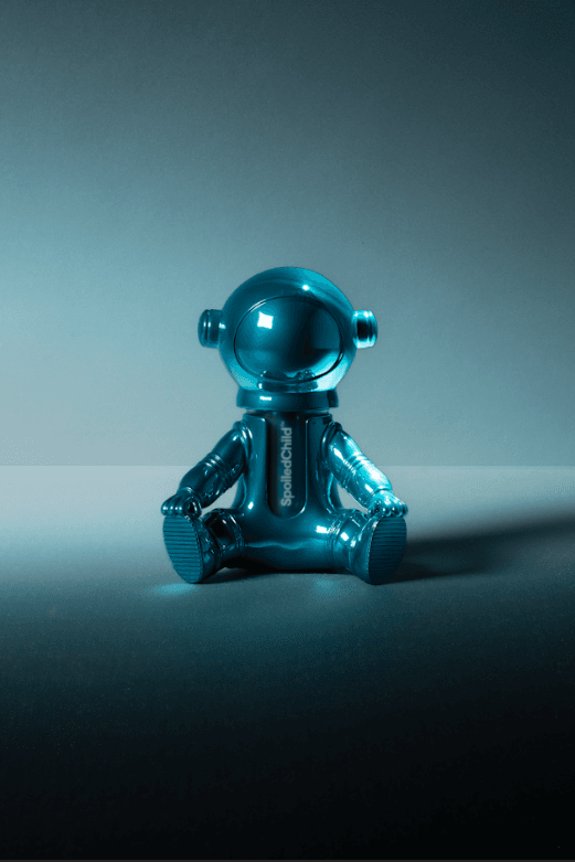 jeremy scott holding a small astronaut with spoiled child skincare inside, beauty