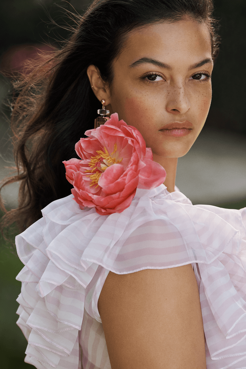 model devyn garcia holding a supersized bottle of victoria's secret bombshell perfume, fragrance, beauty