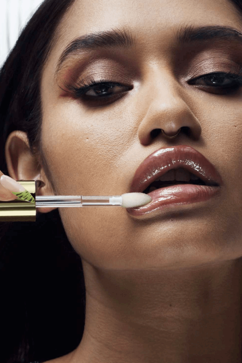 woman with mac cosmetics eyeshadow and lipstick on, new lipglass air gloss and blow plumping lip oil, makeup, beauty