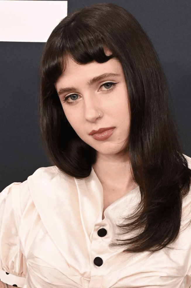 clairo posing with ilia makeup on, first-ever beauty ambassador, skincare