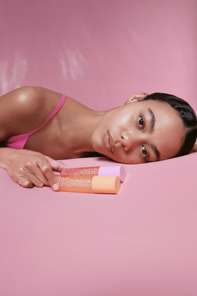 woman posing with new kosas double cleansing system, woman washing her makeup off, new cleanser, skincare, beauty