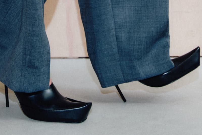 marko bakovic woman heels tights body laying down sofa mules boots